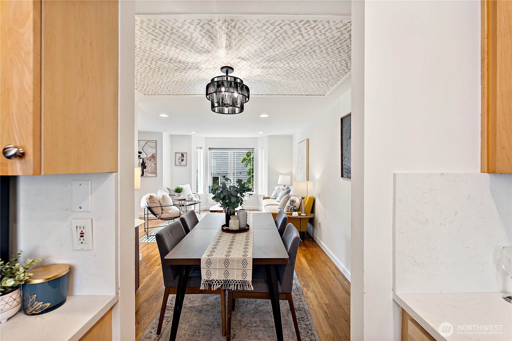 9239 Ashworth Avenue North, Unit B Seattle, WA 98103 - Photo 14 of 40 a view of a dining room with furniture window and outside view