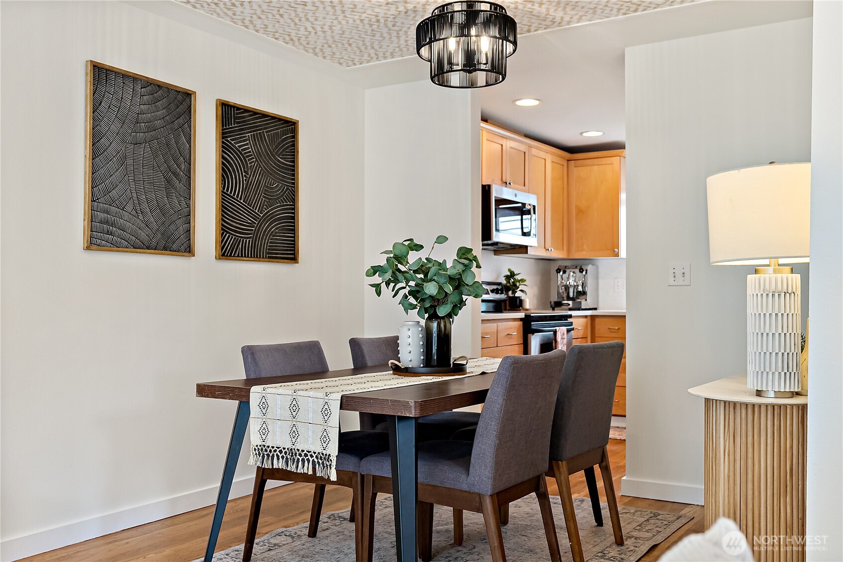 9239 Ashworth Avenue North, Unit B Seattle, WA 98103 - Photo 15 of 40 a dining room with furniture and window