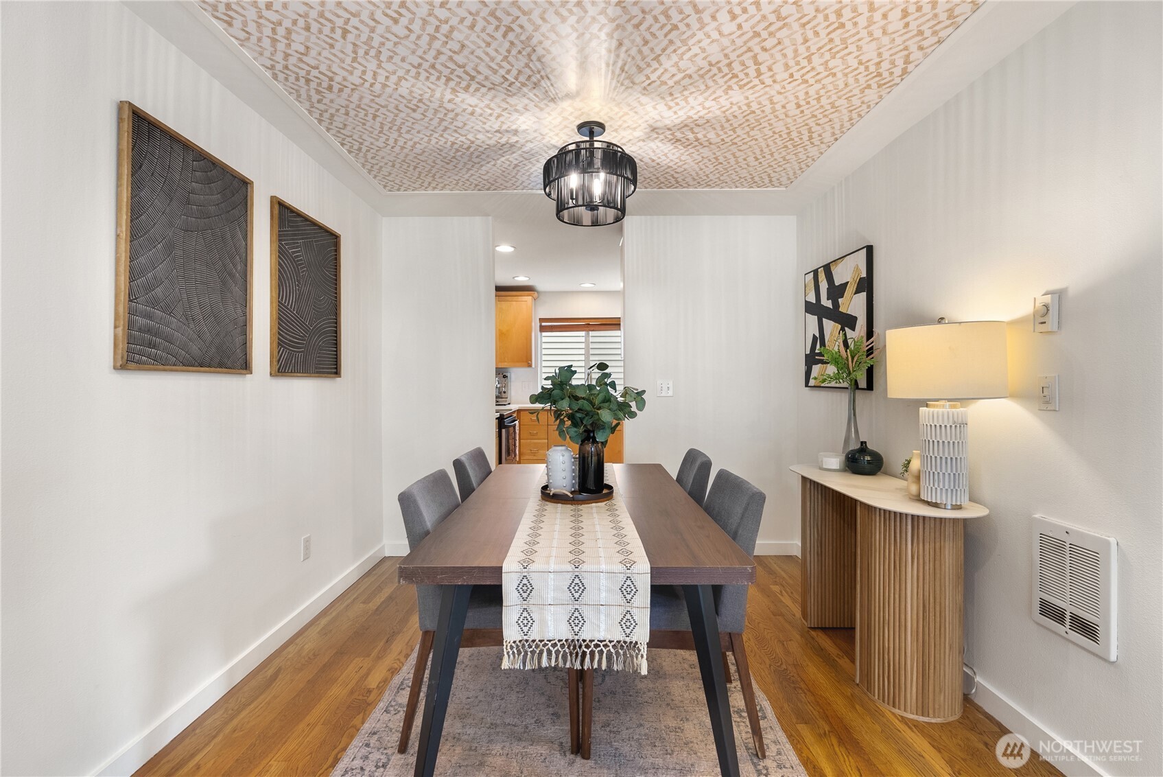 9239 Ashworth Avenue North, Unit B Seattle, WA 98103 - Photo 17 of 40 a view of a dining room with furniture