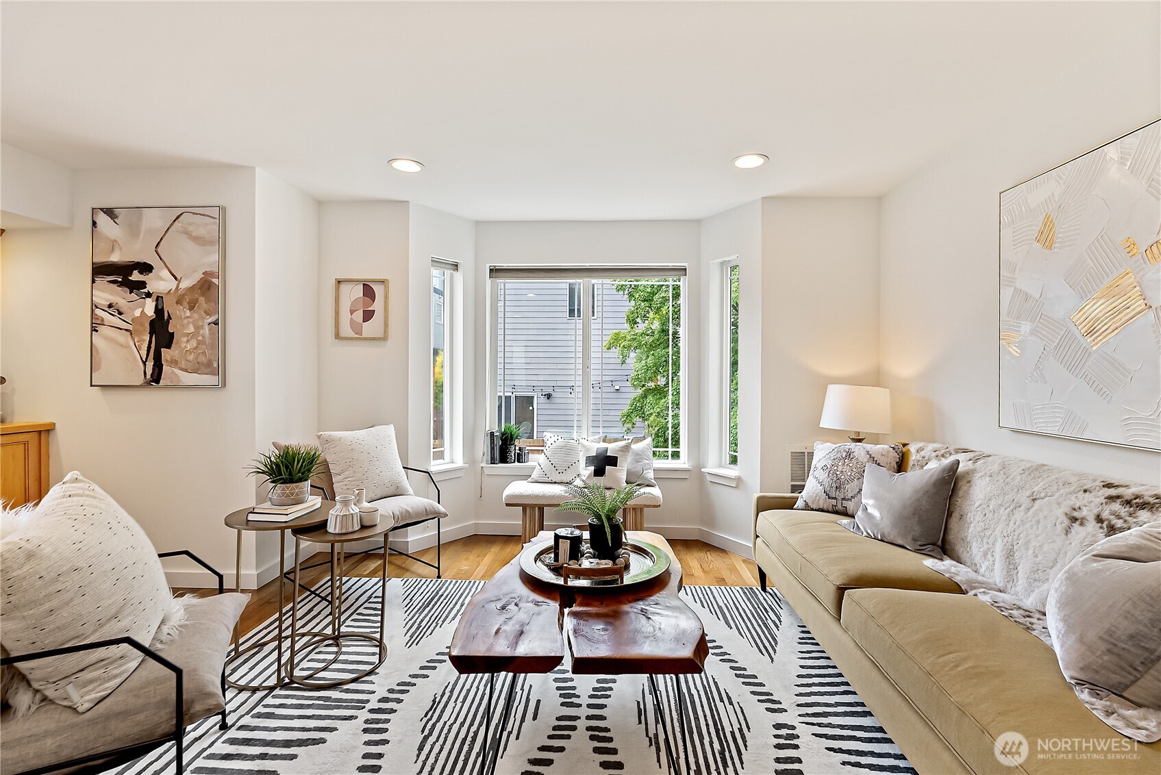 9239 Ashworth Avenue North, Unit B Seattle, WA 98103 - Photo 2 of 40 a living room with furniture and a large window