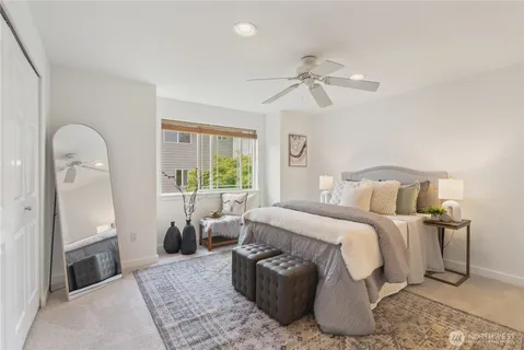 a bathroom with a sink vanity mirror and toilet