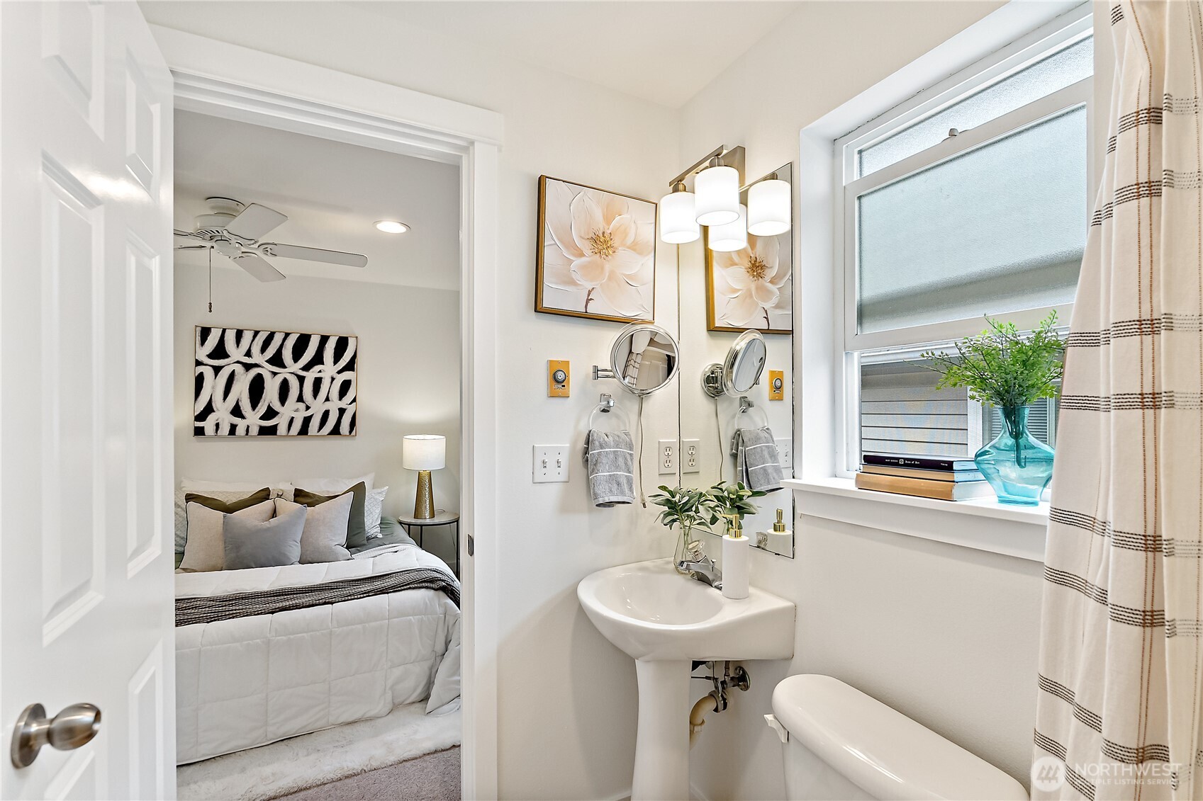 9239 Ashworth Avenue North, Unit B Seattle, WA 98103 - Photo 26 of 40 a bathroom with a sink and a mirror