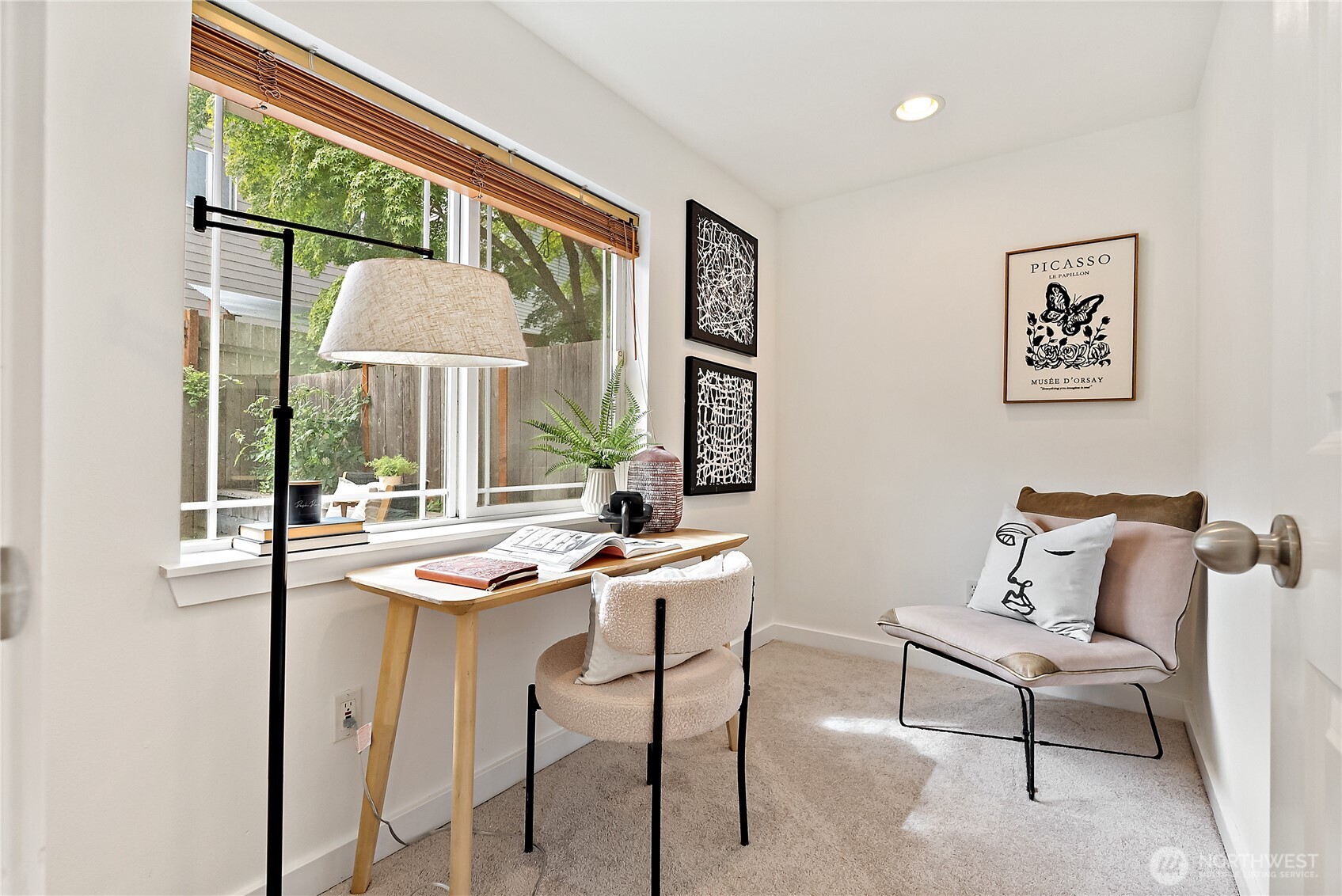 9239 Ashworth Avenue North, Unit B Seattle, WA 98103 - Photo 27 of 40 a view of a livingroom with furniture window and outside view