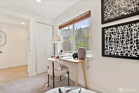 a view of a house with backyard and wooden fence