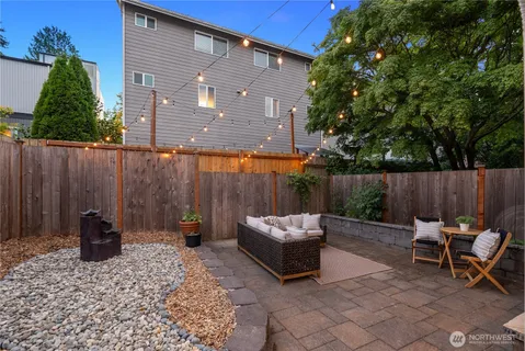 an outdoor space with table and chairs