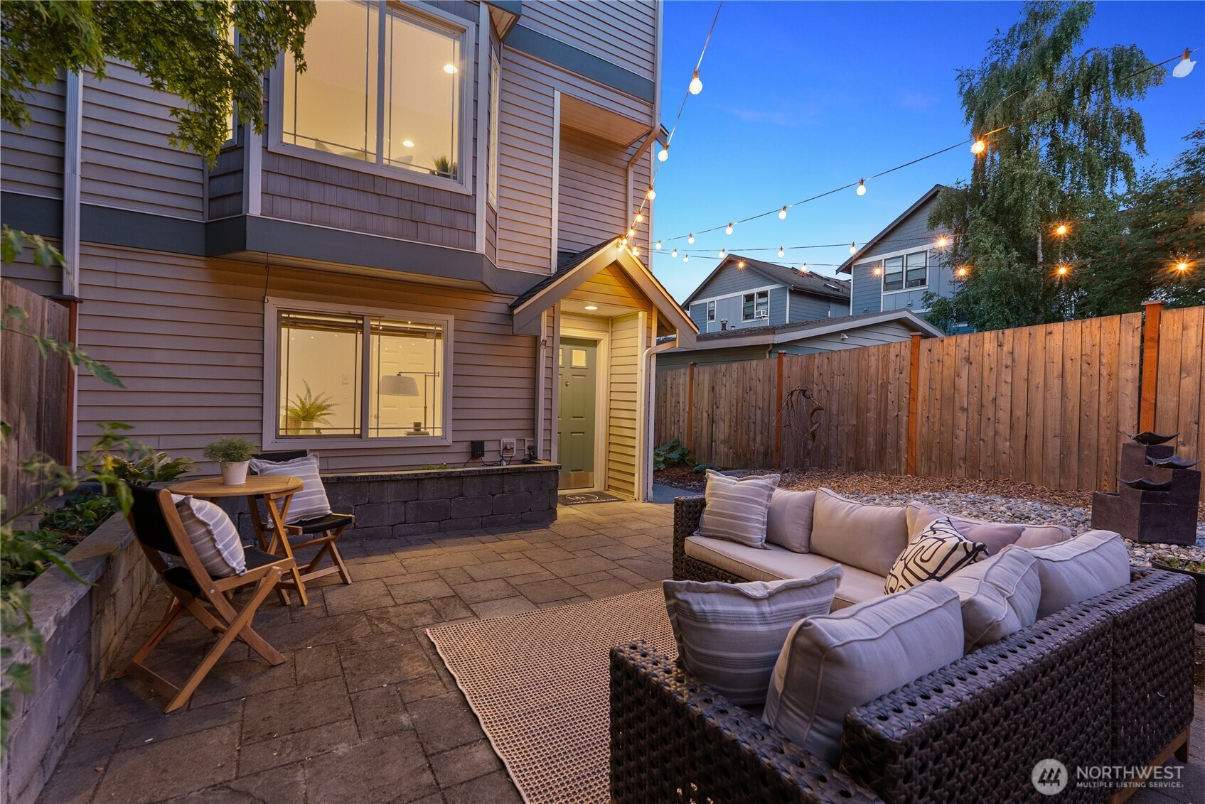 9239 Ashworth Avenue North, Unit B Seattle, WA 98103 - Photo 38 of 40 a building outdoor space with patio furniture