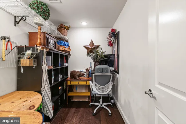 a view of a room with workspace and a window