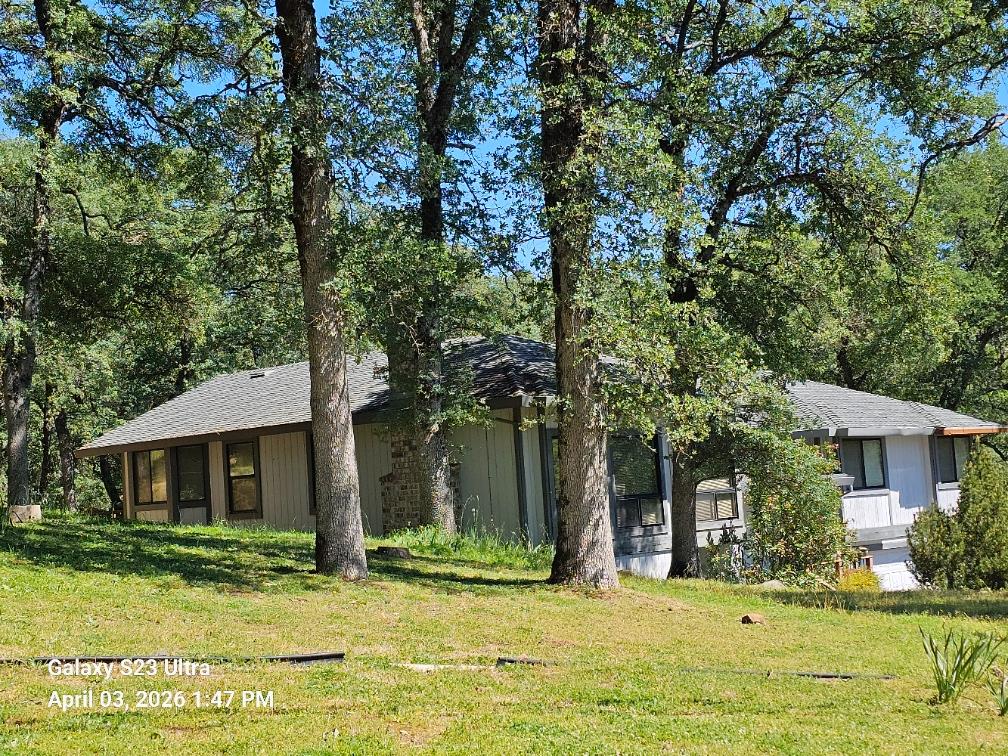 12372 Wanderer Road Auburn, CA 95602 - Photo 2 of 2 a view of a house with a yard