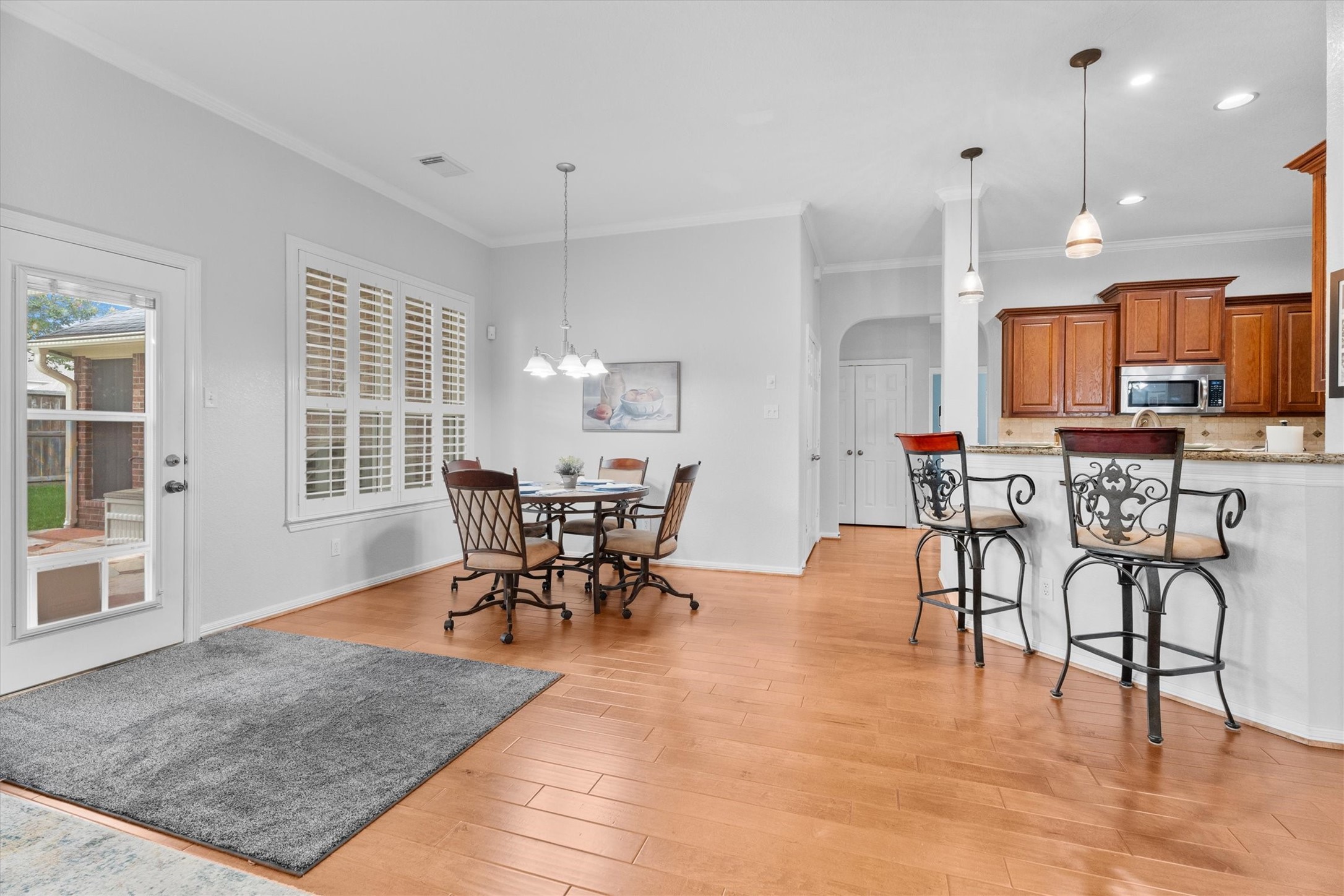 9406 Lochflora Drive Spring, TX 77379 - Photo 20 of 49 a view of a dining room with furniture and wooden floor