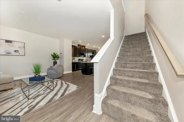 a living room with furniture and a rug