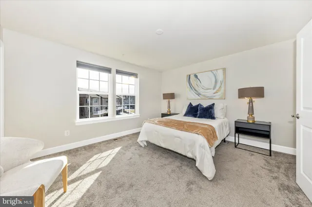 a bedroom with bed and window