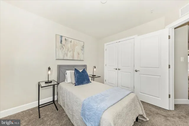 a bedroom with a bed and a cabinets