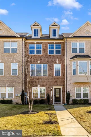 a front view of a building with a swimming pool