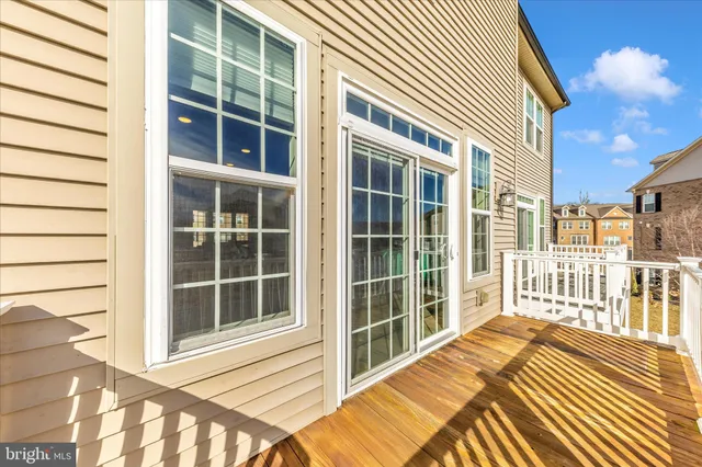 a view of swimming pool with outdoor seating and a pathway