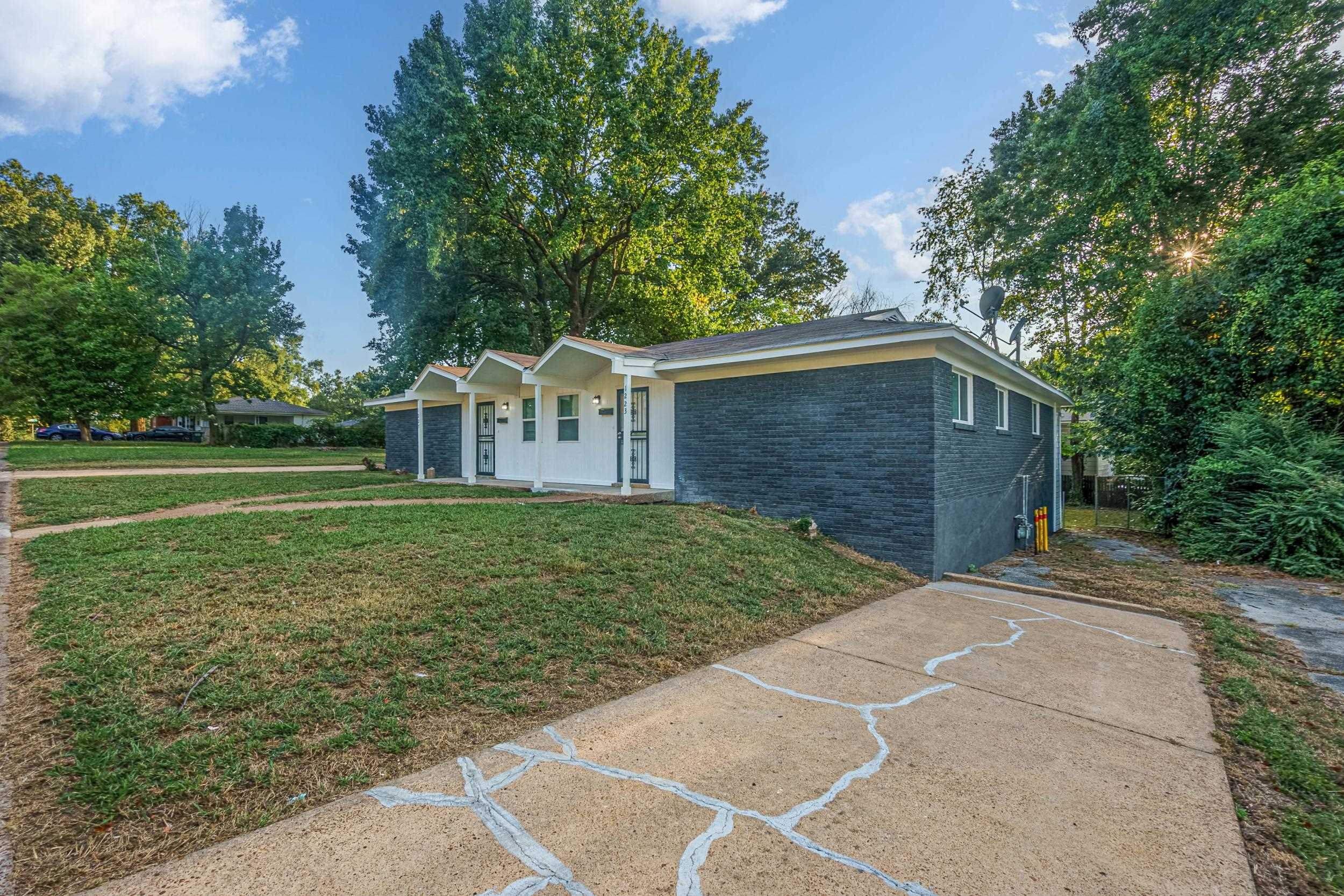 1223 Aubra Road Memphis, TN 38111 - Photo 1 of 19 a front view of a house with garden