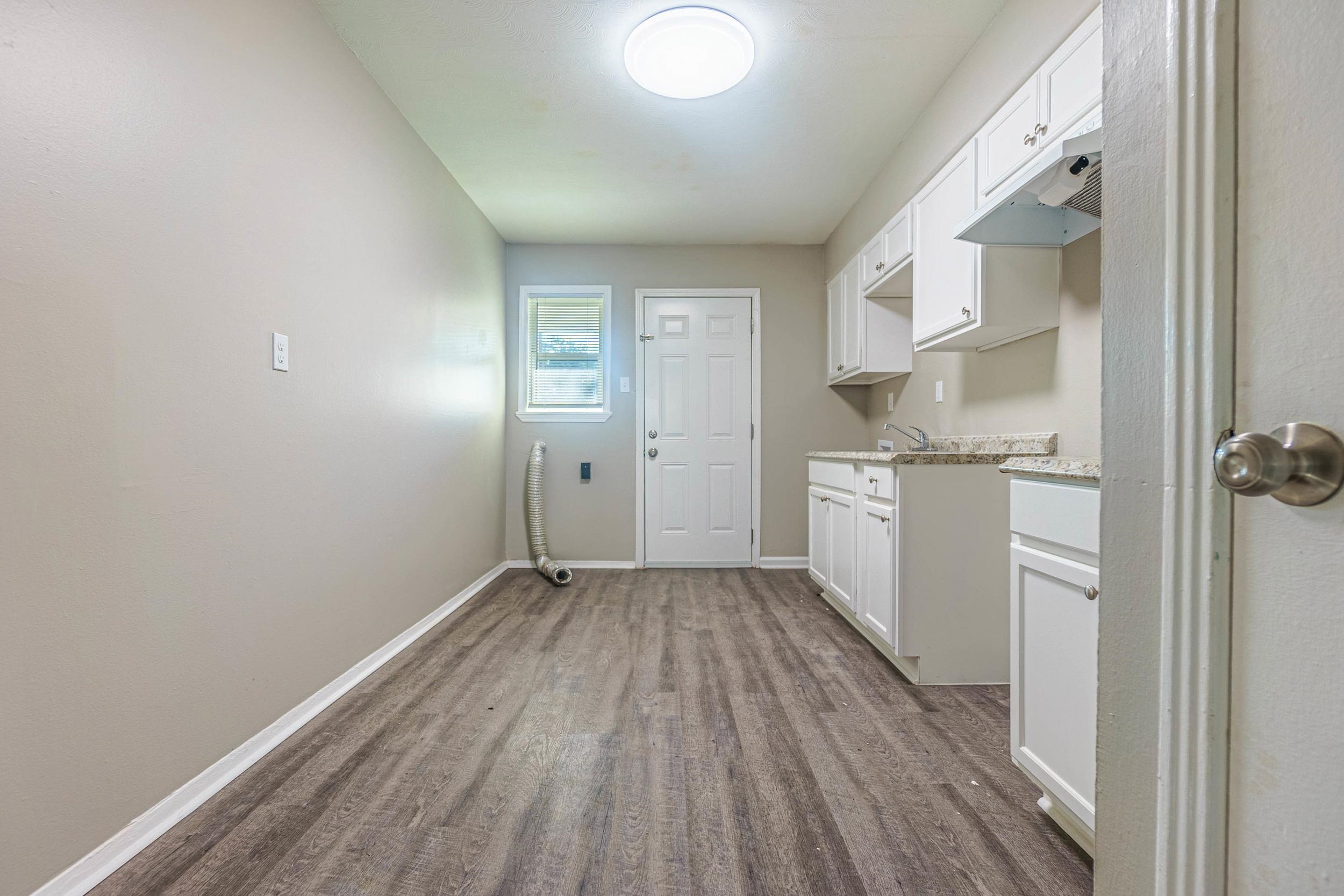1223 Aubra Road Memphis, TN 38111 - Photo 4 of 19 a view of a kitchen with wooden floor and a window