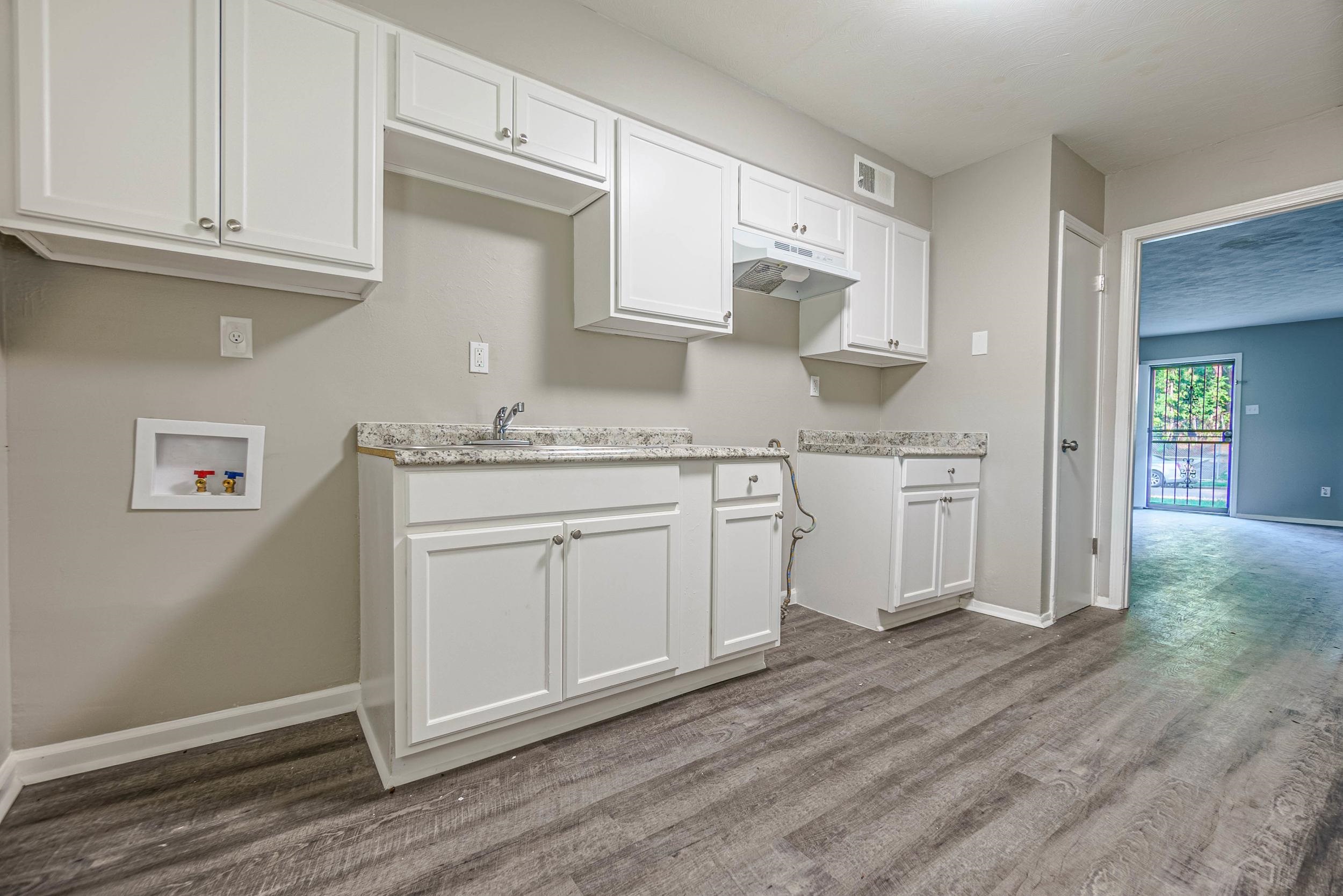 1223 Aubra Road Memphis, TN 38111 - Photo 6 of 19 a kitchen with stainless steel appliances granite countertop a sink and cabinets