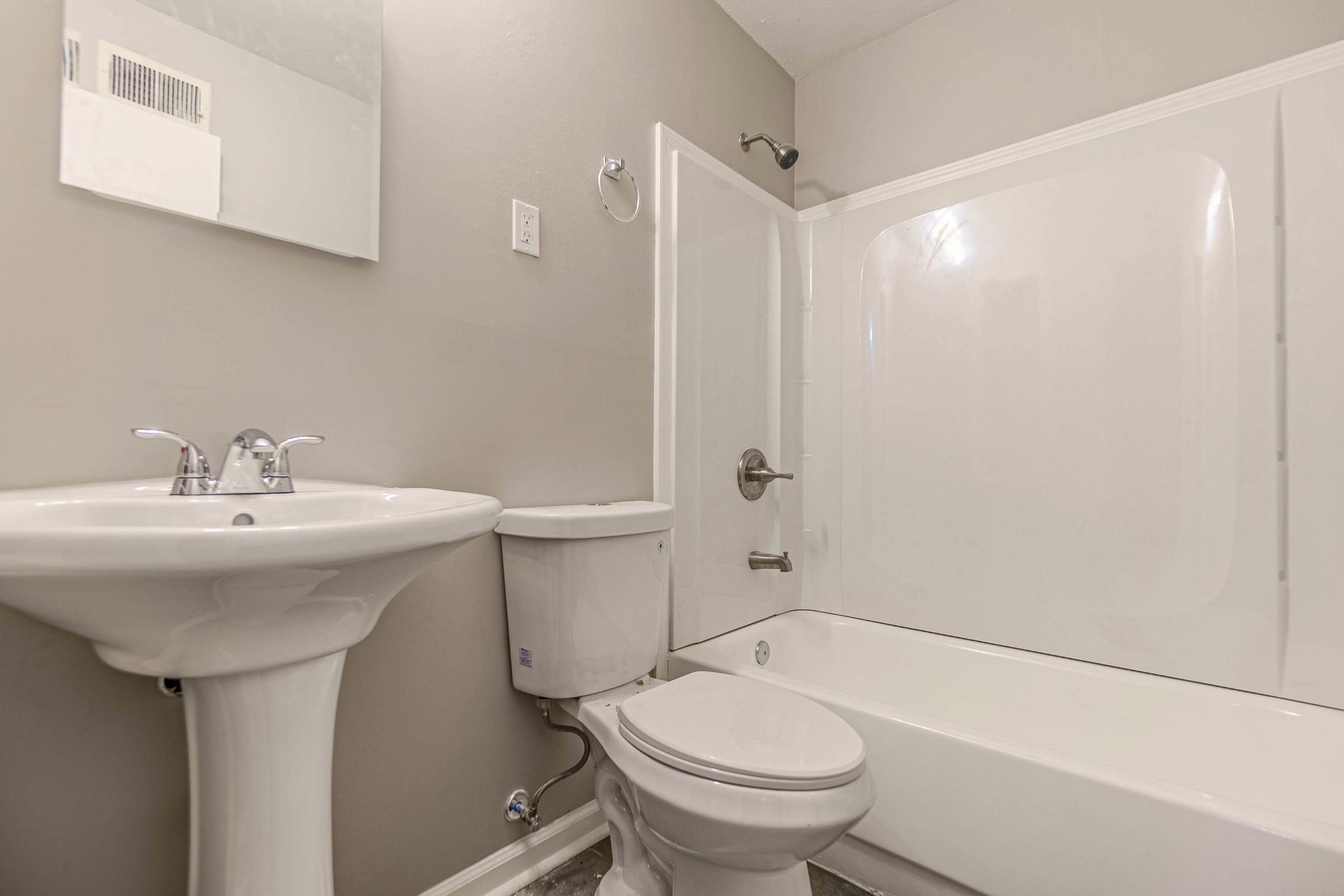 1223 Aubra Road Memphis, TN 38111 - Photo 8 of 19 a bathroom with a sink toilet and shower