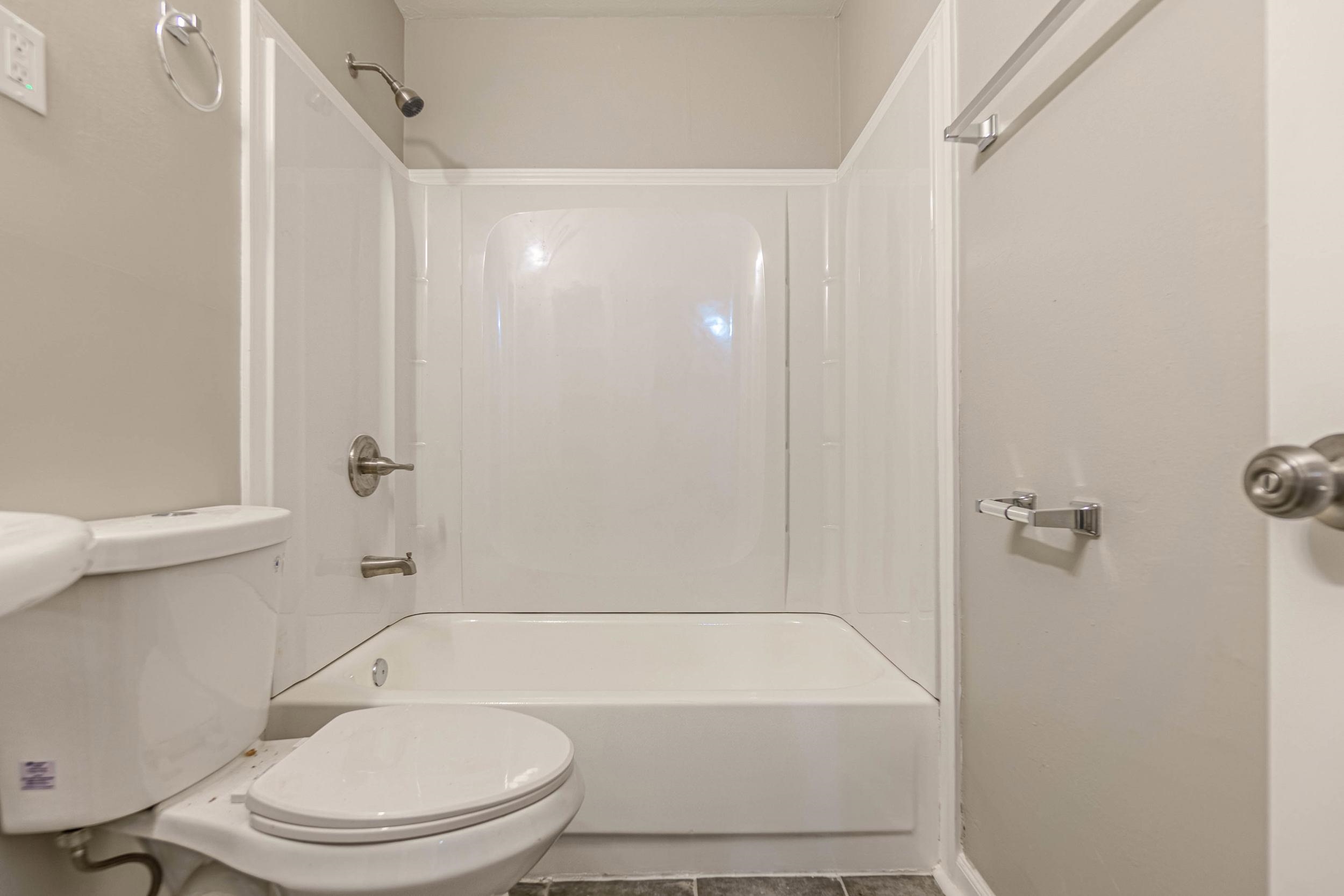 1223 Aubra Road Memphis, TN 38111 - Photo 9 of 19 a bathroom with a bathtub and a toilet