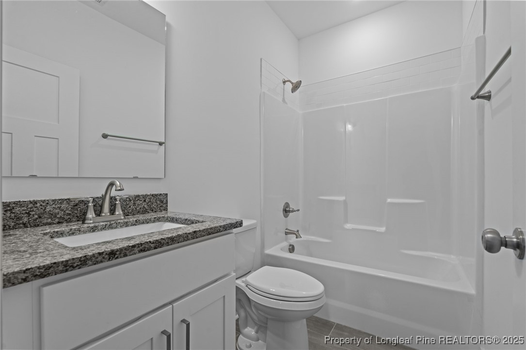 144 Vorster Road Raeford, NC 28376 - Photo 21 of 35 a bathroom with a sink toilet and shower