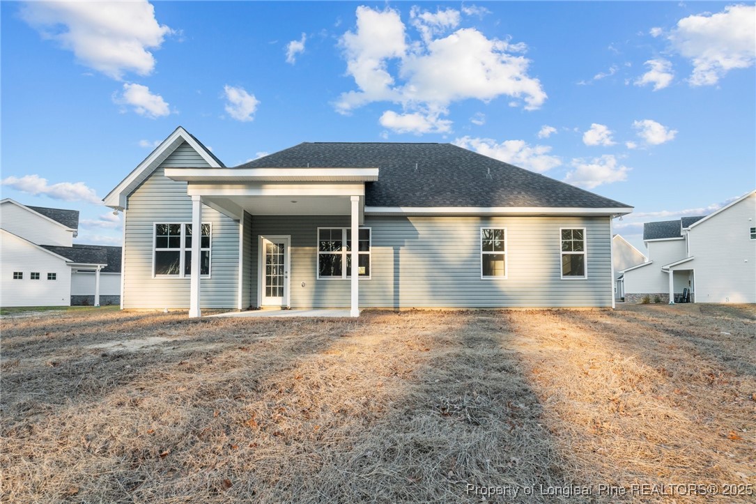 144 Vorster Road Raeford, NC 28376 - Photo 28 of 35 a view of a house with a yard and large tree