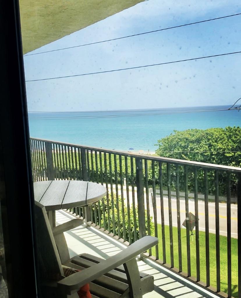 1055 Ocean Drive, Unit 403 Juno Beach, FL 33408 - Photo 16 of 28 a view of a balcony with chairs