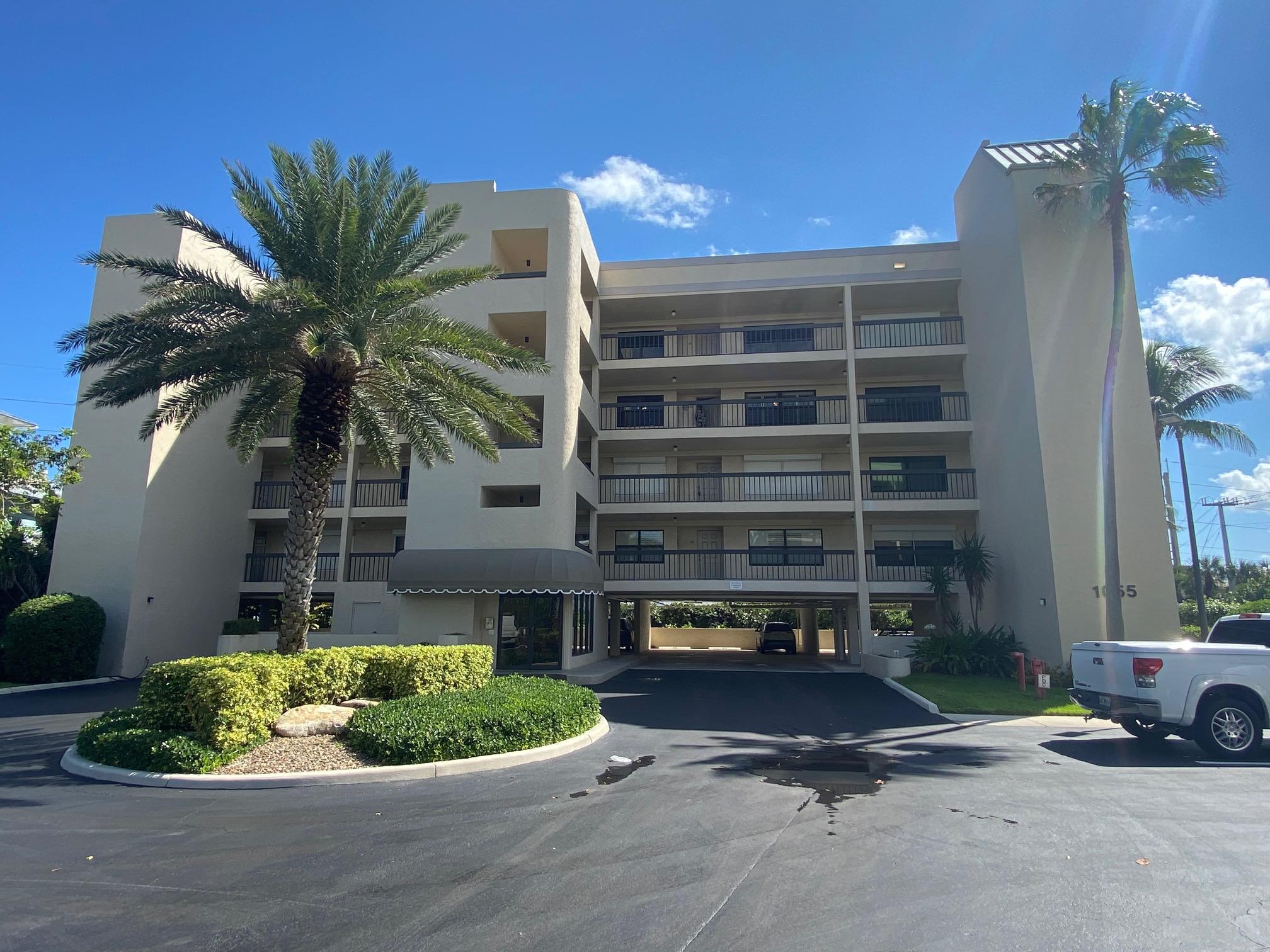 1055 Ocean Drive, Unit 403 Juno Beach, FL 33408 - Photo 20 of 28 a front view of a house with a yard