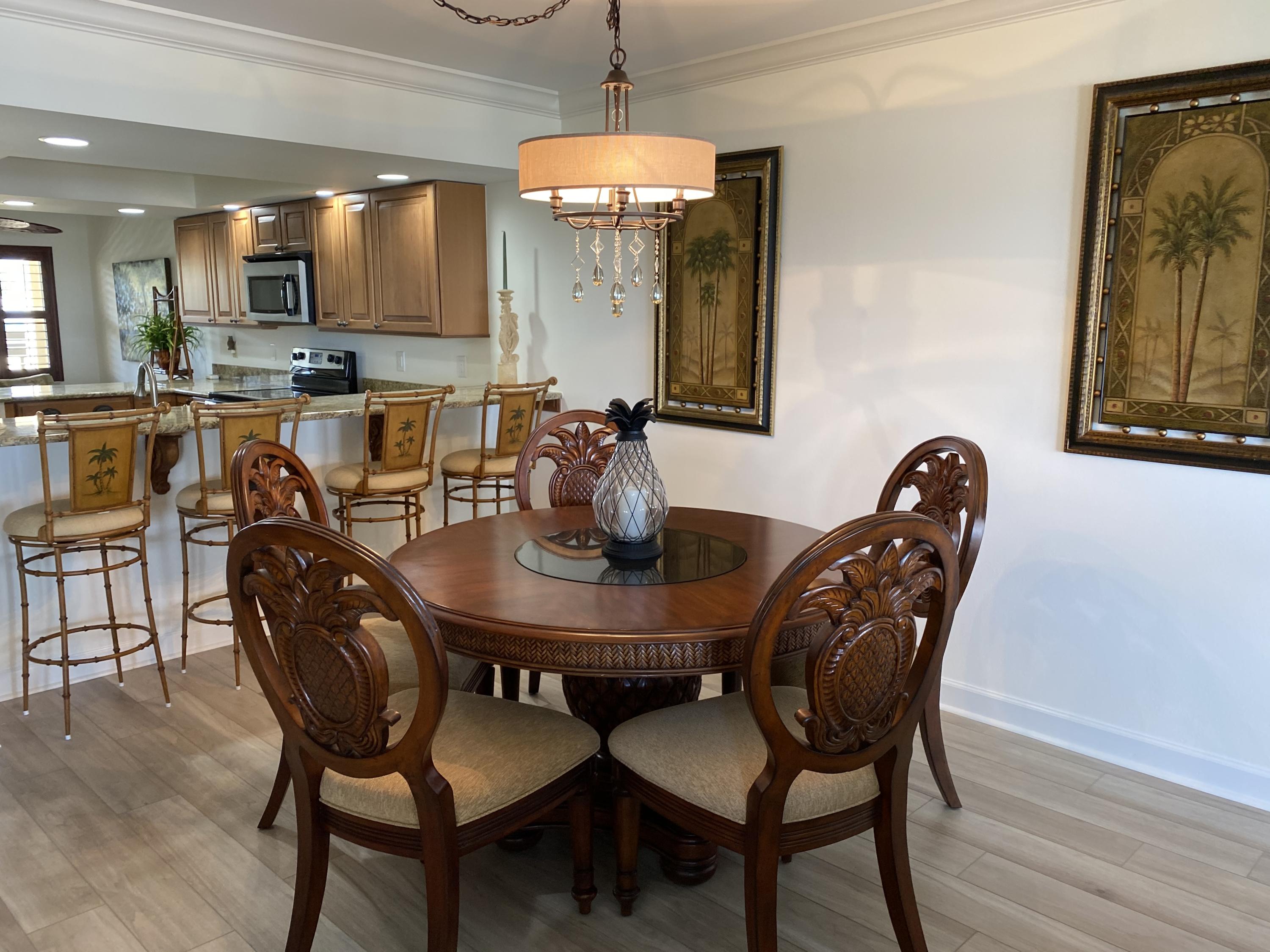1055 Ocean Drive, Unit 403 Juno Beach, FL 33408 - Photo 4 of 28 a dining room with furniture and window