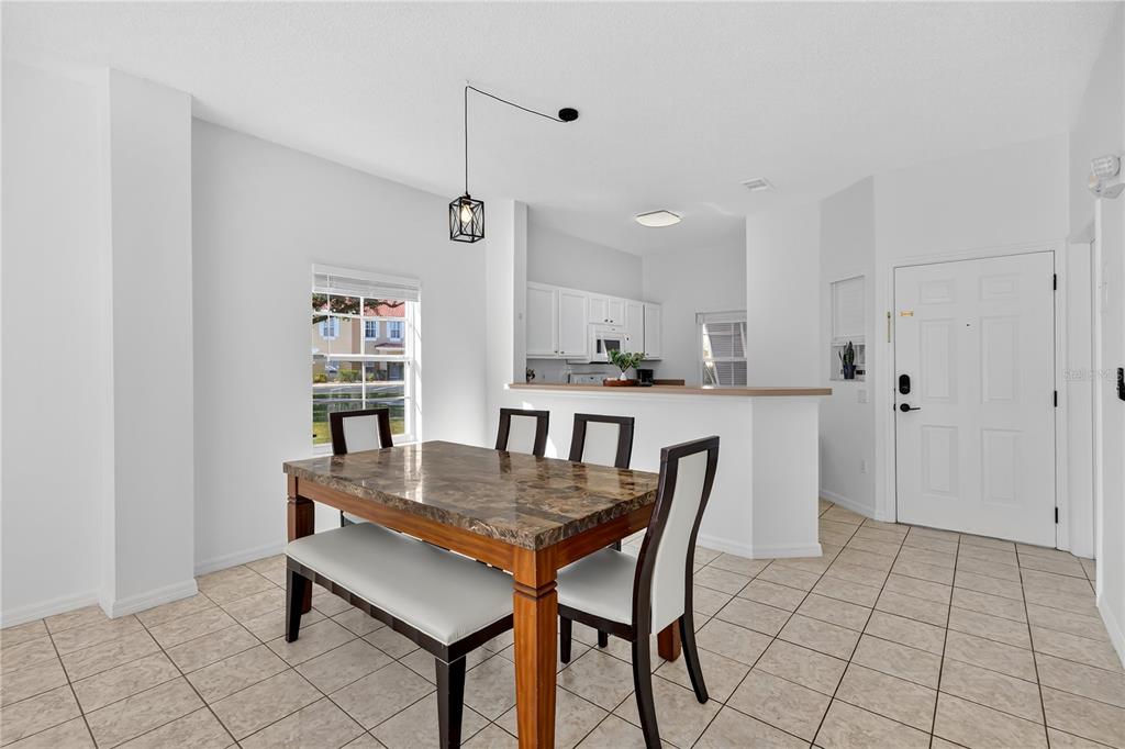 1070 Park Ridge Circle Kissimmee, FL 34746 - Photo 11 of 36 a view of a kitchen and dining room
