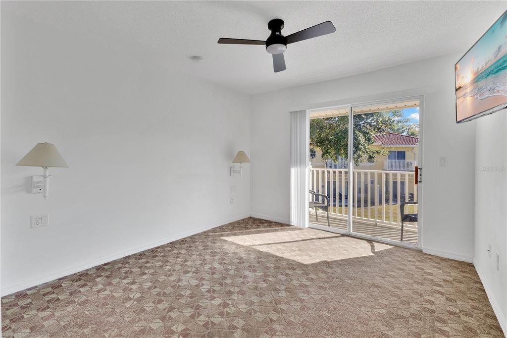 1070 Park Ridge Circle Kissimmee, FL 34746 - Photo 12 of 36 a view of empty room with floor to ceiling window