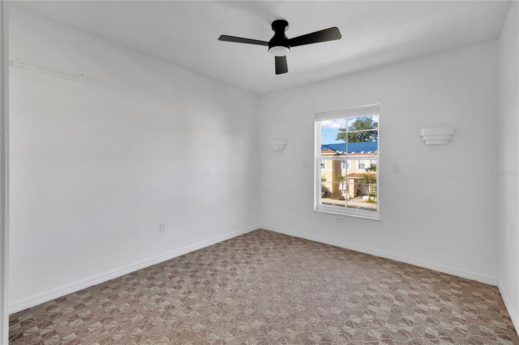 1070 Park Ridge Circle Kissimmee, FL 34746 - Photo 14 of 36 an empty room with windows and ceiling fan