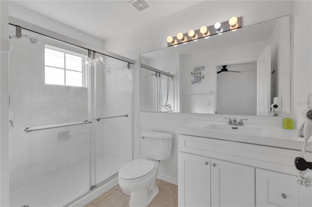 1070 Park Ridge Circle Kissimmee, FL 34746 - Photo 15 of 36 a bathroom with a sink and a mirror