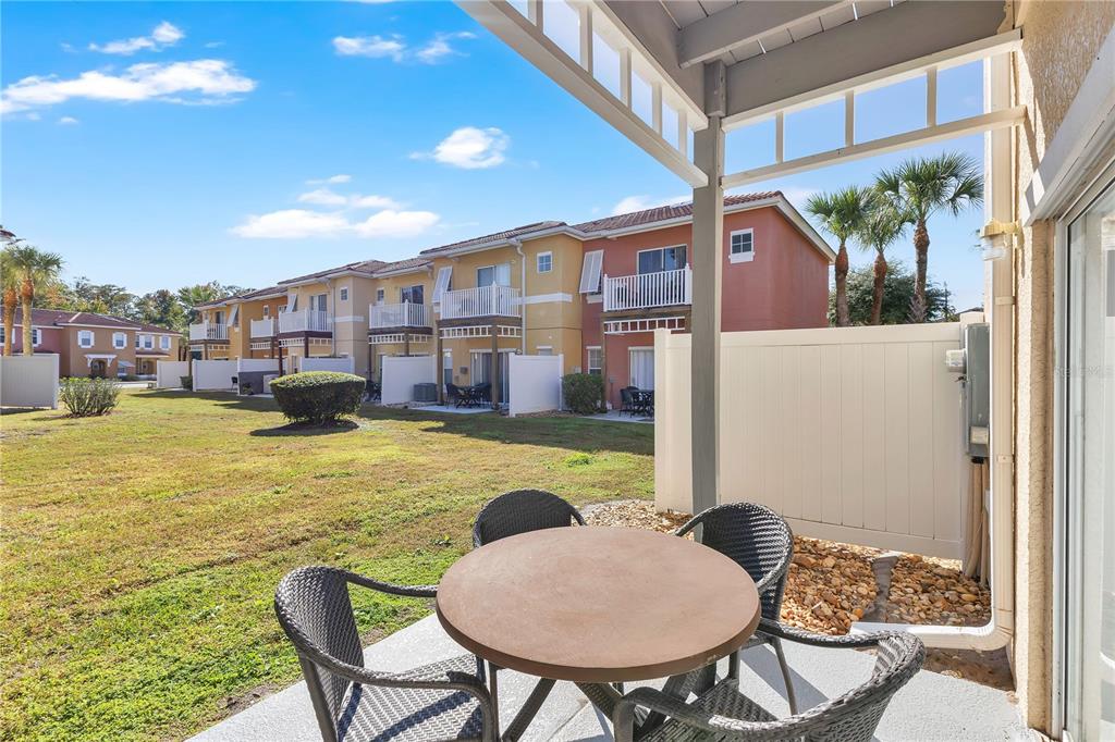 1070 Park Ridge Circle Kissimmee, FL 34746 - Photo 21 of 36 a swimming pool with outdoor seating and yard