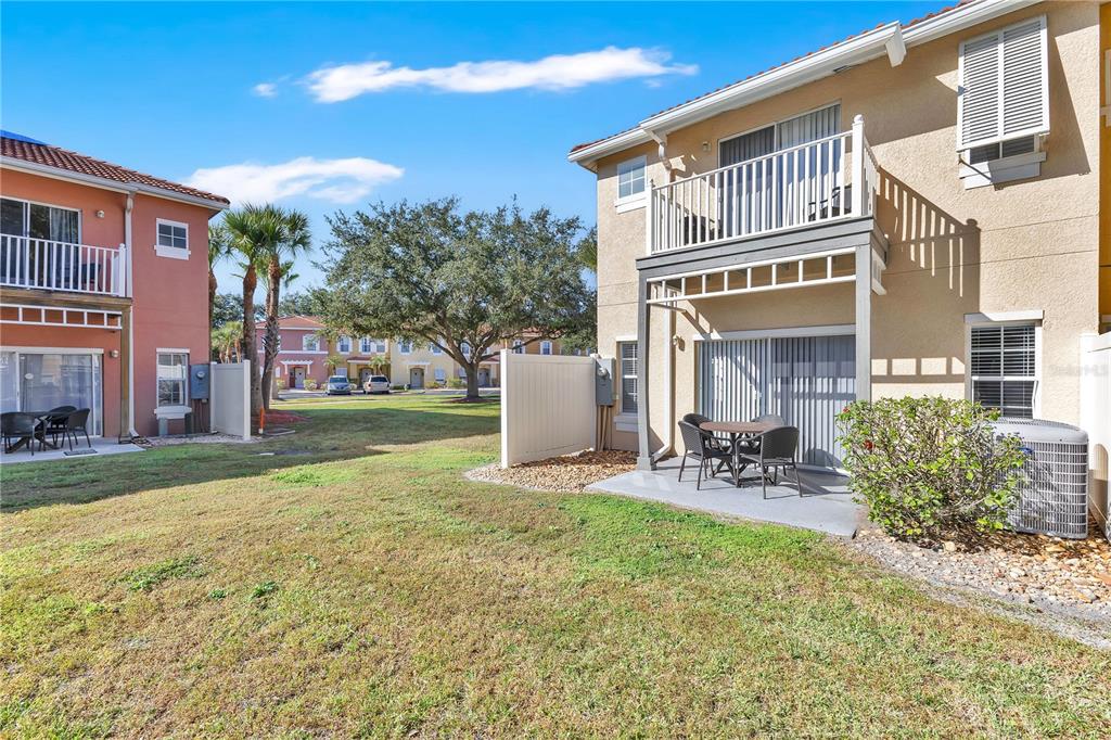 1070 Park Ridge Circle Kissimmee, FL 34746 - Photo 24 of 36 a front view of a house with patio and garden
