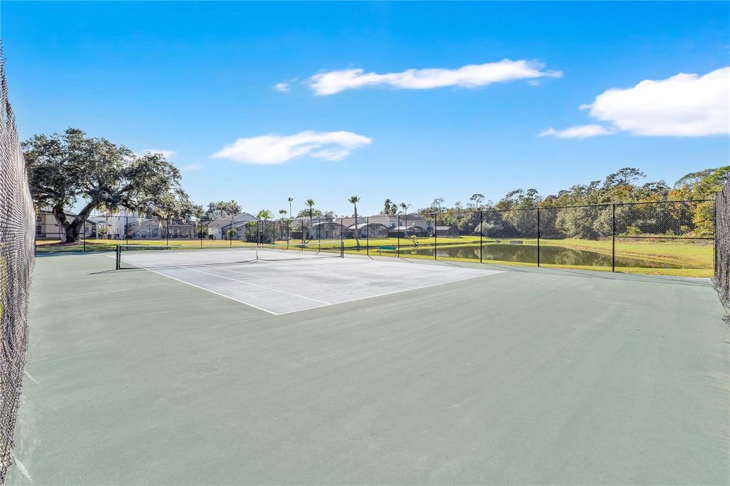 1070 Park Ridge Circle Kissimmee, FL 34746 - Photo 28 of 36 a view of a swimming pool and an outdoor seating