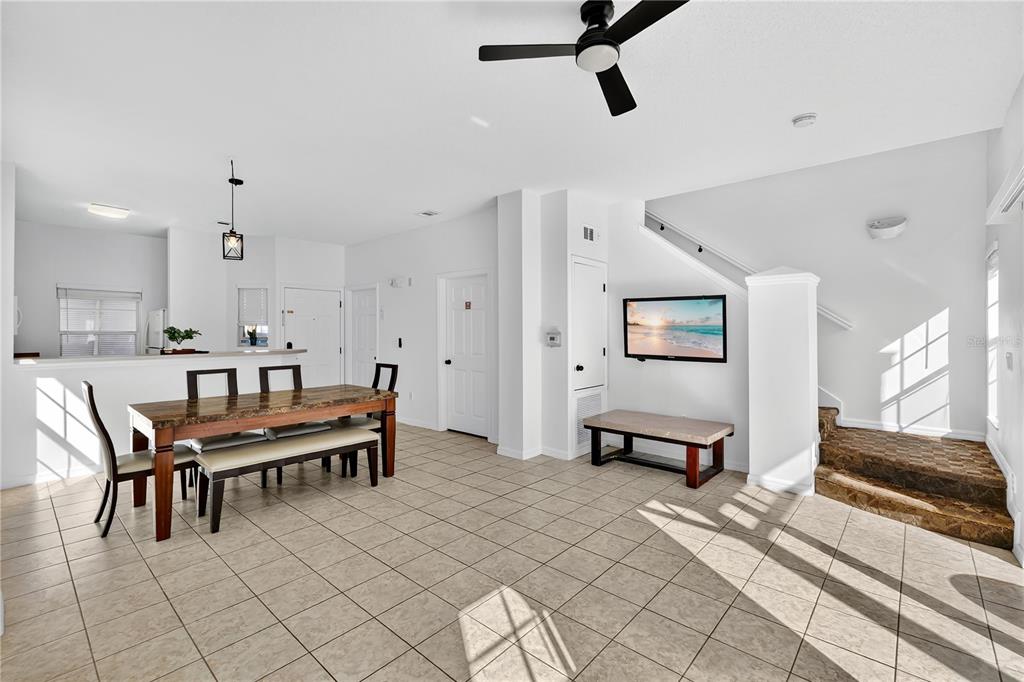 1070 Park Ridge Circle Kissimmee, FL 34746 - Photo 3 of 36 a dining room with furniture and a chandelier
