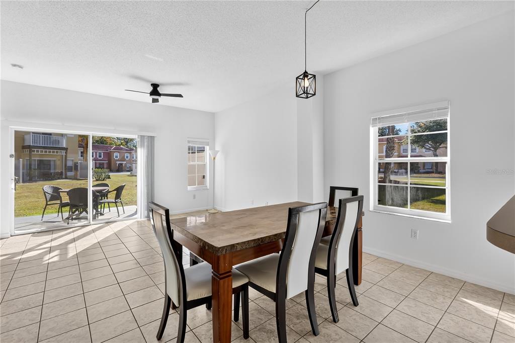 1070 Park Ridge Circle Kissimmee, FL 34746 - Photo 9 of 36 a view of a dining room with furniture