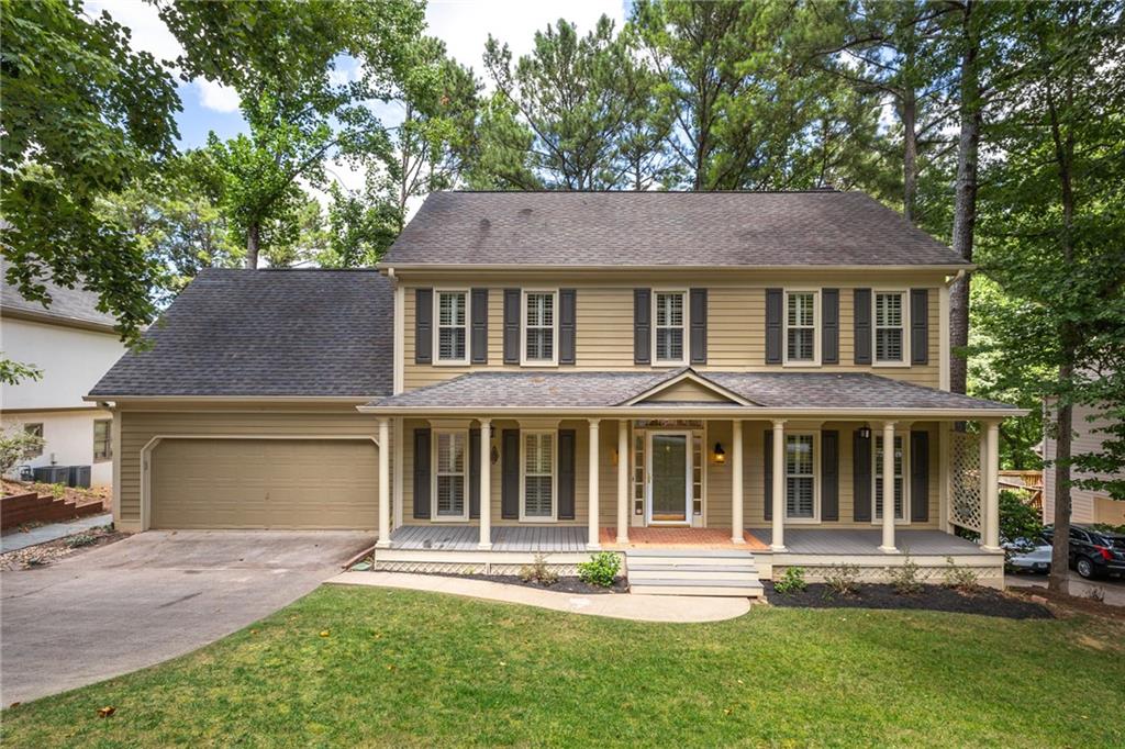 815 Bermuda Run Woodstock, GA 30189 - Photo 1 of 1 front view of a house with a yard