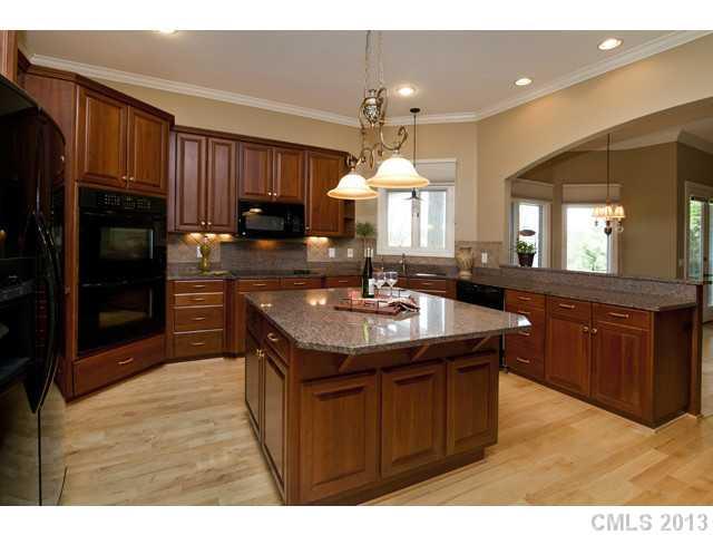 1709 Verdict Ridge Drive Denver, NC 28037 - Photo 7 of 16 a kitchen with a sink stove and cabinets