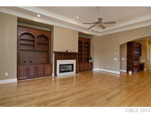 1709 Verdict Ridge Drive Denver, NC 28037 - Photo 10 of 16 a view of an empty room with a fireplace and a window