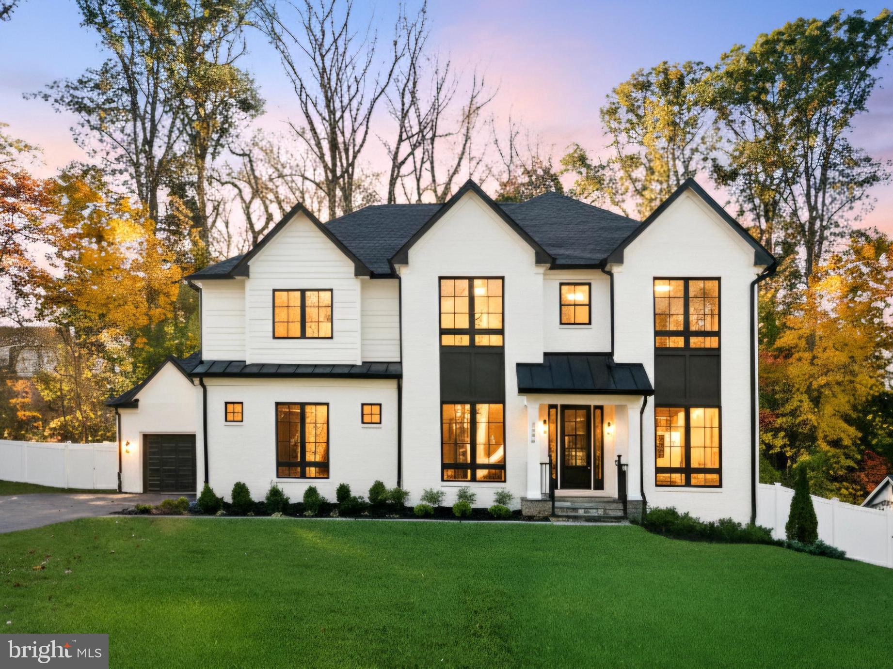 7806 Carteret Road Bethesda, MD 20817 - Photo 1 of 58 a front view of a house with a yard