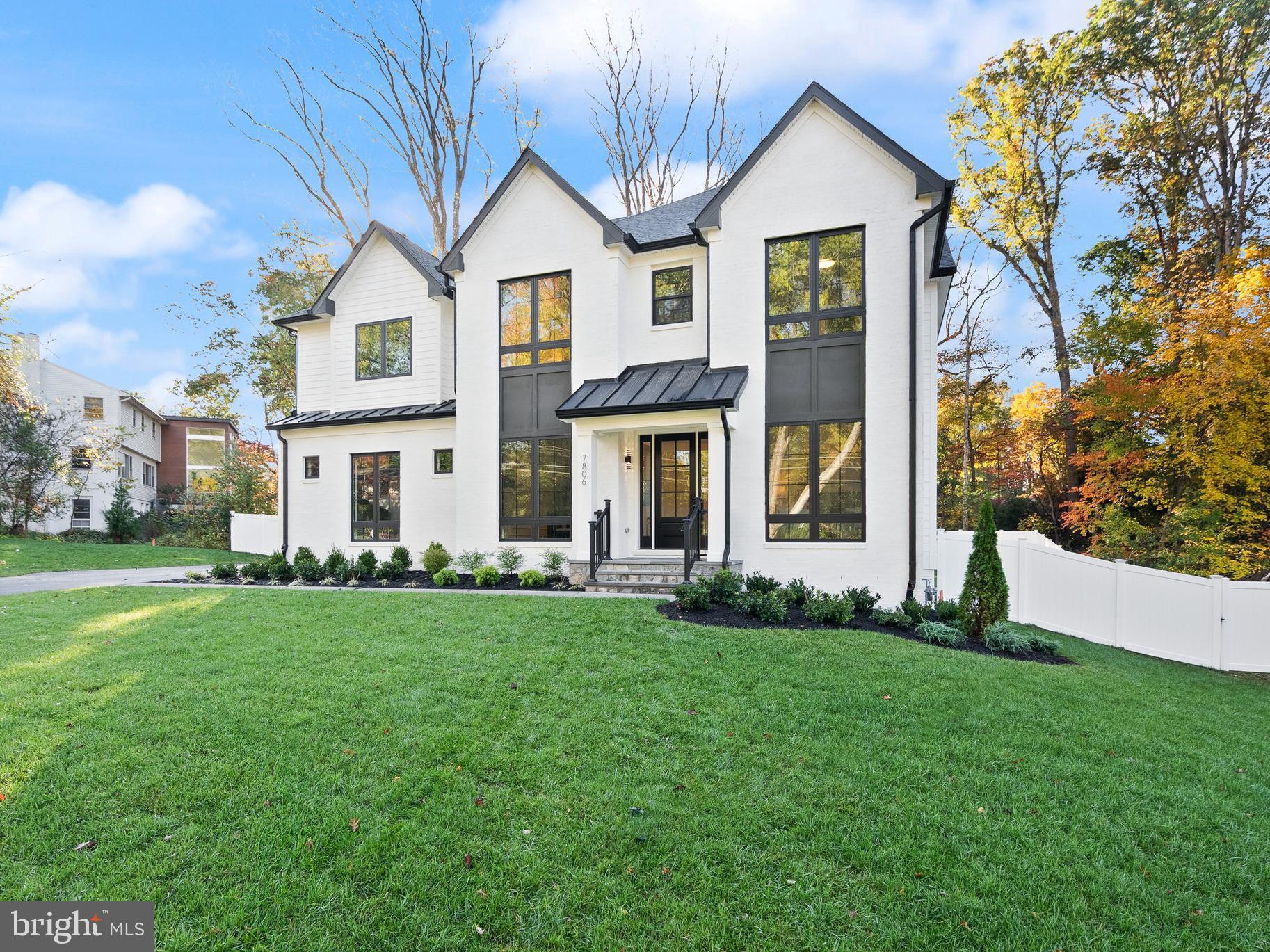 7806 Carteret Road Bethesda, MD 20817 - Photo 2 of 58 a front view of a house with a yard