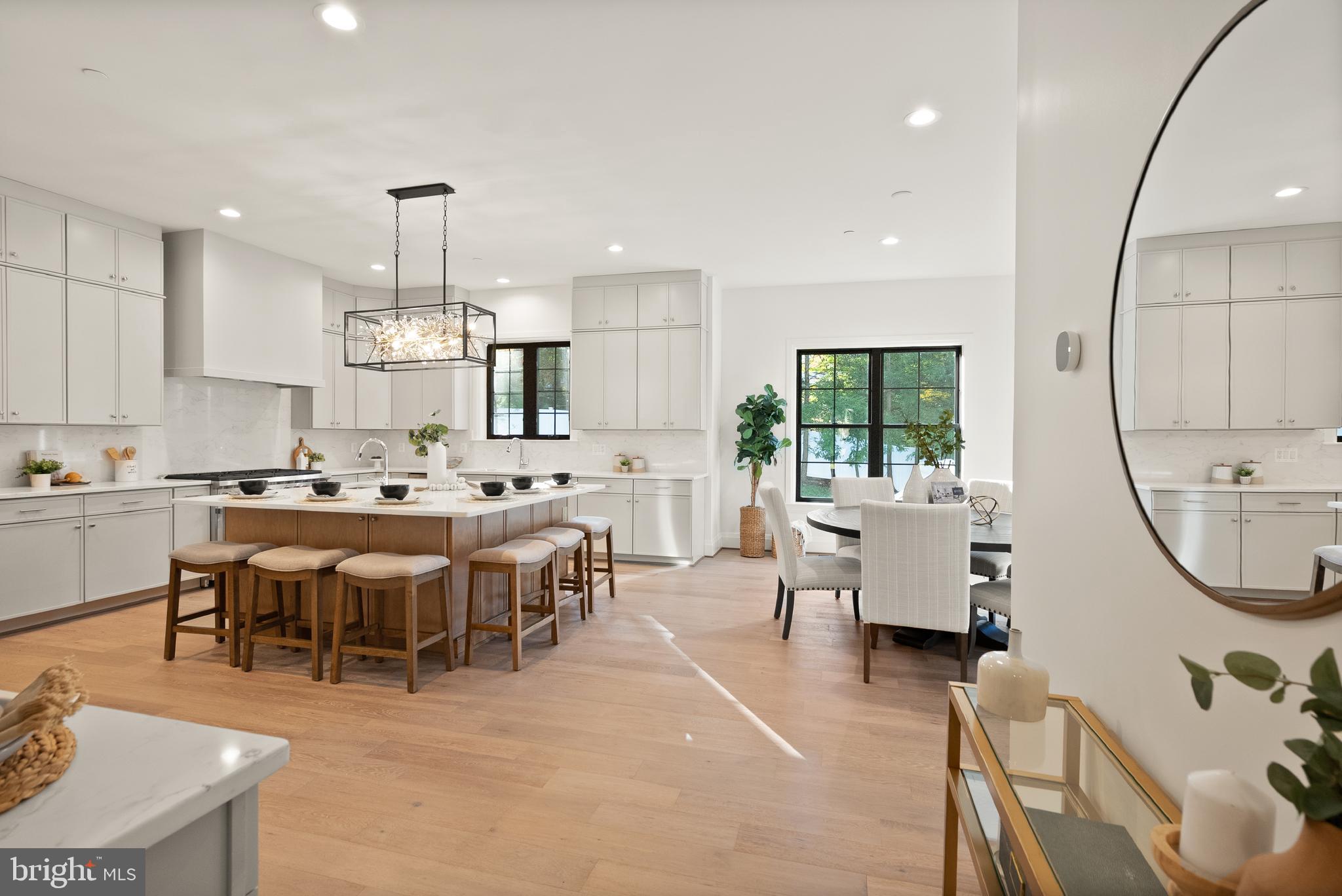 7806 Carteret Road Bethesda, MD 20817 - Photo 26 of 58 a large kitchen with a table and chairs in it