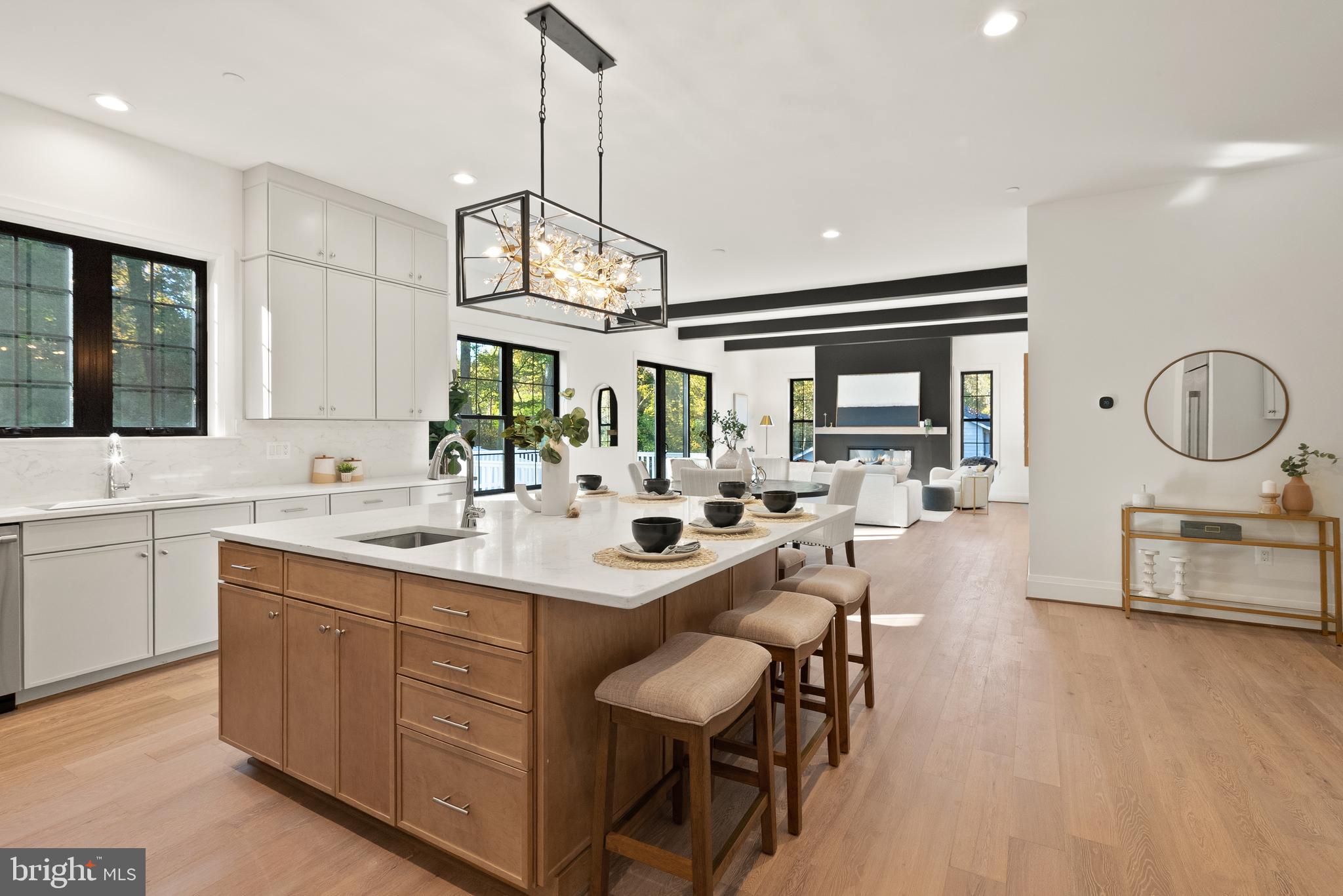 7806 Carteret Road Bethesda, MD 20817 - Photo 29 of 58 a kitchen with a sink stove and wooden floor