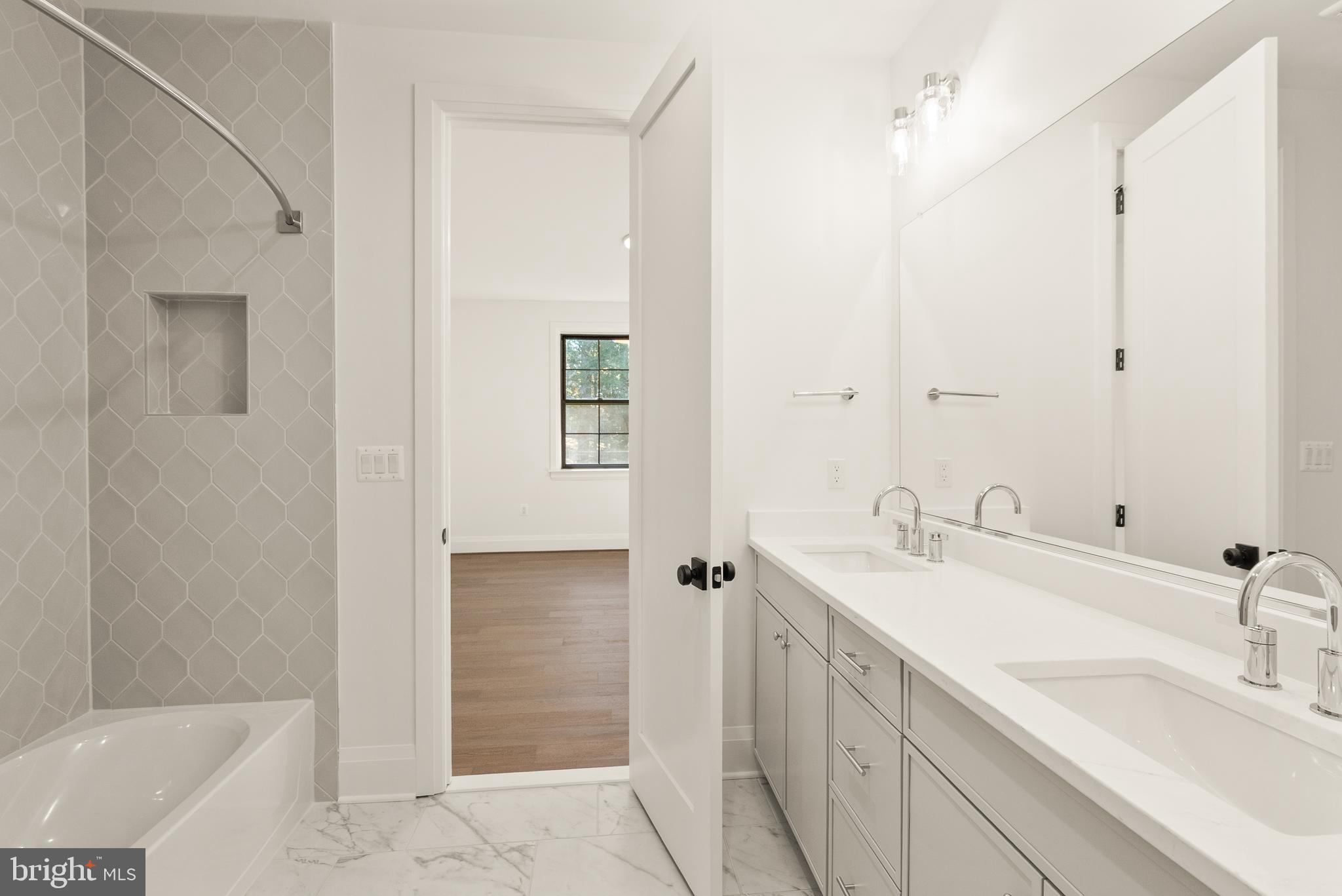 7806 Carteret Road Bethesda, MD 20817 - Photo 46 of 58 a bathroom with a sink and a mirror