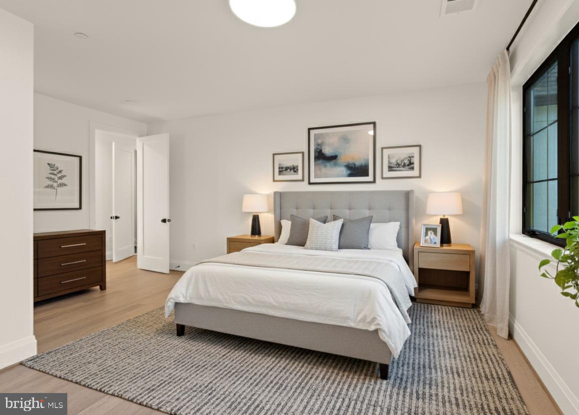 7806 Carteret Road Bethesda, MD 20817 - Photo 47 of 58 a bedroom with a bed and a flat screen tv
