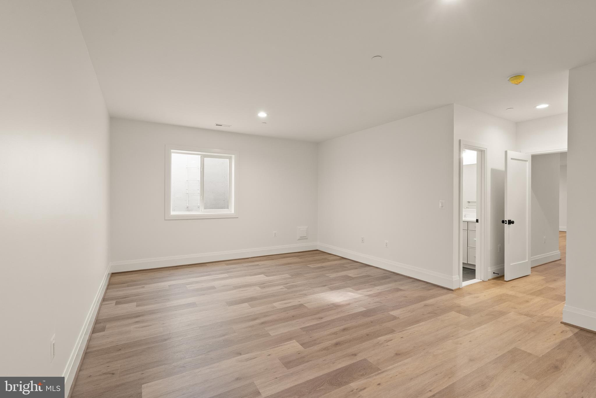 7806 Carteret Road Bethesda, MD 20817 - Photo 50 of 58 a view of an empty room with wooden floor and a window