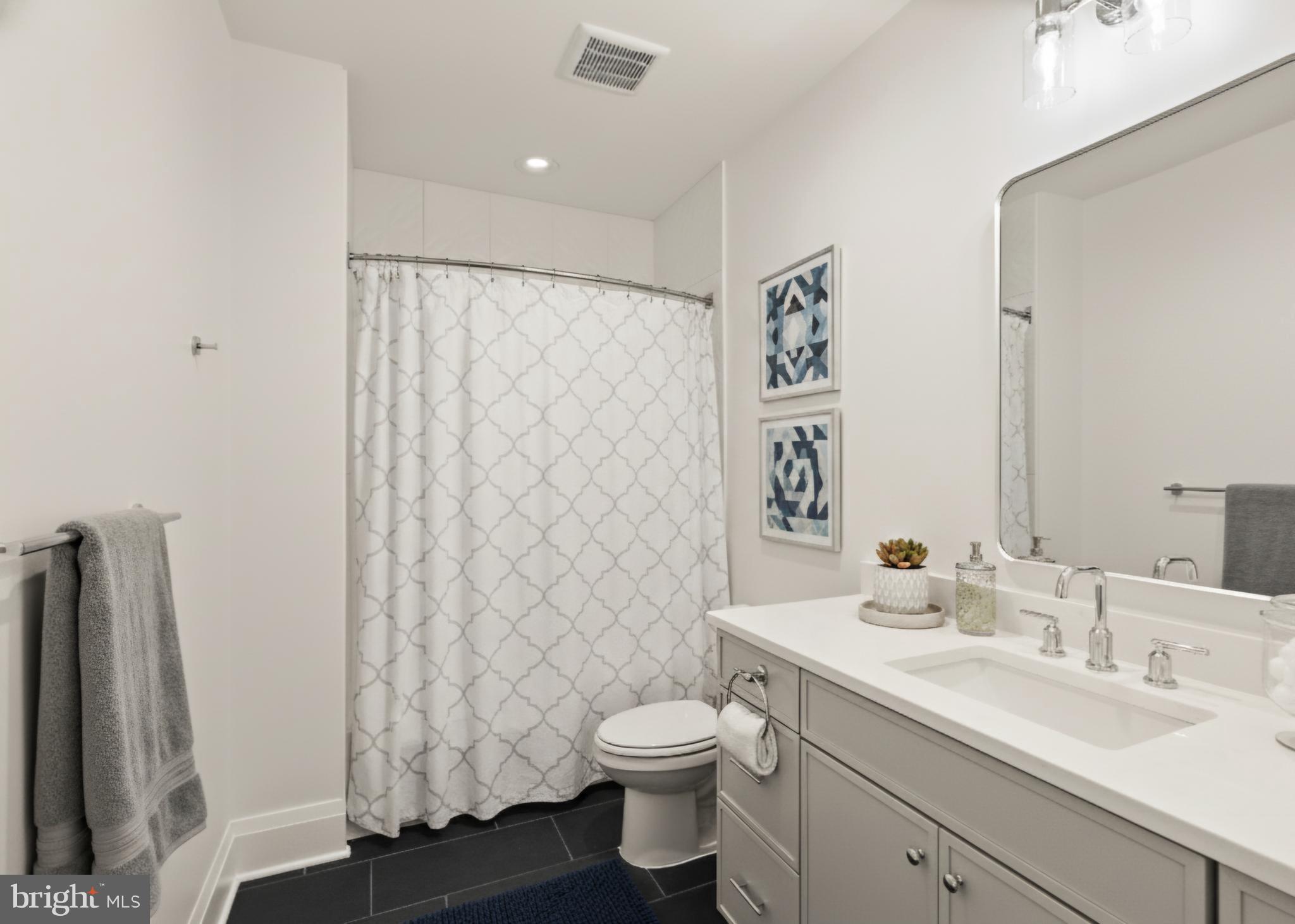 7806 Carteret Road Bethesda, MD 20817 - Photo 58 of 58 a bathroom with a granite countertop sink toilet and shower