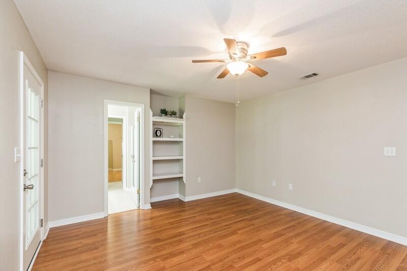 401 Ashley Drive Crestview, FL 32536 - Photo 16 of 36 a view of empty room with wooden floor and fan