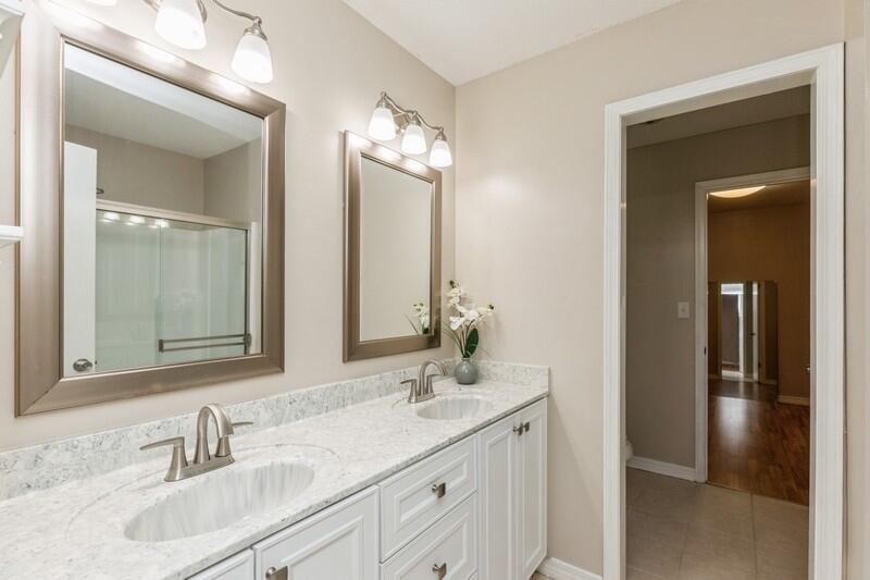 401 Ashley Drive Crestview, FL 32536 - Photo 19 of 36 a bathroom with double vanity sinks and a mirror